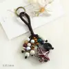 Colgante de bolsa de cuentas de cerámica de Jingdezhen, llavero artístico tejido a mano de semilla de bodhi, adorno colgante de nicho estilo bosque