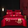 Juego de ropa de cama de lujo estilo chino, hecho de algodón 100% de fibra larga, un juego de cuatro piezas que incluye una sábana y una funda de edredón de algodón puro rojo, perfecto para la alcoba de una recién casada.