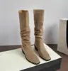 Botas de vaquero western largas retro para mujer, nueva colección otoño/invierno 2026, con un diseño que aumenta la altura, tacones gruesos y un estilo fruncido de tacón apilado, también conocidas como botas altas de montar