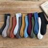 Calcetines para mujer de caña media de rizo otoño e invierno calcetines largos de lana engrosados de terciopelo para el suelo calcetines tipo toalla cálidos venta al por mayor