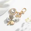 Llavero de Trébol de Cuatro Hojas con Pedrería Moda Europea y Americana Transfronteriza Colgante de Perla en Forma de Corazón Accesorios para Llavero de Bolso de Niña