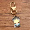 Vários acessórios de joias personalizadas de liga europeia e americana para a temporada de formatura, incluindo charmosos pingentes de capelo, flor e papel de prova.