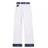 Jeans de pierna recta ajustados estilo retro americano con un diseño único, corte limpio, bloques de color lavados y dobladillo remangado