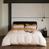Juego de cuatro piezas minimalista bicolor de algodón de fibra larga de lujo ligero, juego de ropa de cama para el hogar de algodón 100% suave como la seda con sábana, funda de edredón, funda de almohada, juego doble