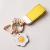 Nuevo Llavero Macaron Taobao Simple Elegante Lindo Colgante para Bolso Mini Llavero Anti-Pérdida para Coche Lote