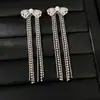 Brincos de prata banhados a ouro real com zircônia, flor, laço e franja, brincos elegantes e estilosos com senso de luxo e sofisticação