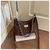 Elegante bolso de dos tonos para mujer, nuevo modelo de moda 2026, bolso de hombro simple, versátil para el trabajo y uso casual, bolso cruzado