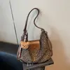 Mochila súper popular de nicho con estampado de leopardo para mujer, nueva mochila escolar estudiantil de moda 2026, bolso de hombro de gran capacidad para el día a día