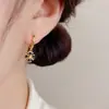 Pendientes de aro cruzados de estrella y luna personalizados exagerados transfronterizos europeos y americanos, aretes de estilo elegante, simple, dulce y genial al por mayor
