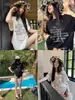 Camiseta Curta de Algodão Puro Preta Doce e Descolada com Laço e Letras para Mulheres, Novo Estilo de Verão Solta e Relaxada