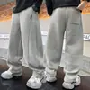Calça Jogger Solta Estilo Coreano para Meninos Estilo Primavera e Outono para Crianças de Meia-Idade e Mais Velhas Moda Casual Tendência Cool Esportiva Calça Longa Cor Sólida Estilo Versátil