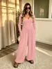 Nuevo mono cruzado europeo y americano de Amazon para mujer, estilo simple, color liso, casual, manga larga, sin espalda, pierna ancha