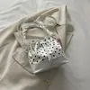 Bolso bandolera nuevo de principios de otoño 2026, bolso de mano cuadrado pequeño de moda niche vintage para mujer, bolso de hombro casual simple y moderno