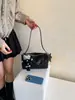 Bolso de mujer tejido nuevo más vendido, bolso cruzado coreano de nicho, bolso de hombro de moda coreana, bolso tipo almohada, bolso negro para el trabajo