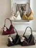 Bolso tote de color liso de gran capacidad, nuevo diseño de moda para principios de otoño de 2026, bolso de hombro nicho de alta apariencia para mujer