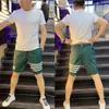 Pantalones cortos de verano finos de secado rápido para hombre, marca de moda Pu Shuai, holgados, combinan con todo, a rayas, para correr, deportivos, de cinco puntos, para la playa, para hombre