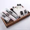 Set de suministros desechables para hotel cepillo de dientes de cerdas suaves peine bolsa de película suave artículos de tocador juego completo venta al por mayor directa de fábrica