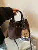 Bolso de Diseño de Nicho de Gama Alta para Mujer 2026 Nueva Moda Versátil Bolso Cruzado para Viajar Bolso de Mano Retro Bolso Cubo