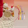 Colgante de moneda pequeña de oro puro 999 "Flor del Dinero" serie de llaveros de cuero con cordón, un regalo promocional para tiendas de oro