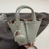 Bolso único con patrón de lichi para mujer, nuevo bolso de cubo de hombro de moda primavera 2026, bolso cruzado versátil con cadena