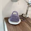 Bolso de mano de diseño de nicho estilo coreano de alta gama para mujer, nuevo modelo primavera 2026, bolso simple de hombro y cruzado