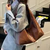 Moda 2026 Bolso de Mano Feeling para Mujer Súper Caliente Versátil Gran Capacidad Bolso de Hombro Único Nuevo Simple Japonés Coreano Superficie Brillante