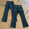 Jeans retro estilo americano con bordado de espinas para hombres y mujeres, pantalones casuales de pierna ancha, corte limpio y acampanados para exportación