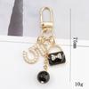 Yi Lian - Nuevo colgante de perla de aleación de zinc con forma de corazón, accesorio de joyería DIY, hebilla para puerta, pequeño colgante estilo Chanel para funda de teléfono móvil