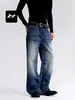Jeans de mezclilla lavada estilo vintage con efecto bigote de gato, diseñados para hombres y mujeres, con corte holgado, estilo versátil y una silueta casual de pierna curva.