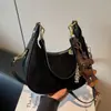Bolso de axila tipo 'dumpling' de nicho francés de alta gama transfronterizo para mujer, nuevo bolso de mano de moda, bolso de hombro versátil de estilo extranjero
