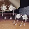 Pendientes de Tachuela Elegantes con Borla de Flor Blanca de Gama Alta Estilo Coreano para Mujer Pinzas para Orejas de Bobina de Mosquitos Pendientes Pequeños Frescos
