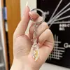 Chaveiro de Pingente de Concha Luminosa Simulada Acrílica Transparente Transfronteiriço para Casal Chaveiro Feminino Joias Atacado
