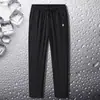 Pantalones casuales para hombre, de seda de hielo, finos, de secado rápido, deportivos, holgados, de talla grande, de primavera y otoño, de pierna recta.