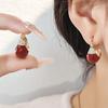Pendientes geométricos de aceite rojo Ankola, pendientes retro Joker de moda, pendientes de temperamento de alta gama de nicho para mujeres, venta al por mayor