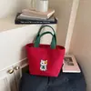 Bolsa de Mão Coreana Nova para o Verão 2026 Transfronteiriça Grande Capacidade Moda de Nicho Bolsa Tote Versátil para o Trabalho
