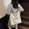 Bolsa de Lona Estilo Coreano Literaria Casual Versátil Lavada Desgastada Bolso de Mano Transfronterizo Estampado de Letras Bolso de Hombro para Mujer