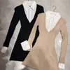 Vestido de punto negro puro y seductor estilo francés con diseño de dos piezas falsas, caracterizado por un cuello de camisa y una falda corta plisada para otoño
