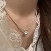 Versión Coreana Diseño de Nicho Flor de Nácar Cepillado Collar de Perlas para Mujer Nuevo de Alta Gama Versátil Moderno Lujo Ligero Cadena para la Clavícula