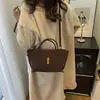 Bolsa tote de moda retrô francesa para mulheres, versátil, de alta qualidade, adequada para o trabalho, bolsa de mão, bolsa de ombro, bolsa de nicho, bolsa de asa