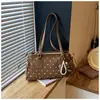 Bolso de hombro de lunares estilo coreano transfronterizo para mujer, nuevo bolso de axila de moda otoño 2026, bolso de mano de nicho y elegante