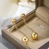 Pendientes de botón minimalistas redondos de oro de 14 quilates transfronterizos europeos y americanos con cadena larga, Pendientes elegantes y sencillos de perla redonda