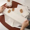 Blanco puro, Grado A, algodón sin blanquear, tiro medio, bragas de triángulo sin costuras, diseño simple y elegante, refuerzo antibacteriano 7A, ropa interior femenina transpirable y amigable con la piel