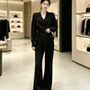 Nuevo estilo de moda con cuello relajado, suéter de punto ajustado y pantalones de pierna ancha, conjunto de dos piezas en gris y negro