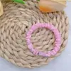 Anel de intestino pequeno pequeno de alta elasticidade na cor creme pode ser acessórios pegajosos DIY faixa de cabelo faixa de cabelo corda de cabelo versátil acessórios de cabelo
