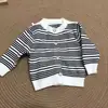 Suéteres de otoño e invierno para niños y niñas 2026 estilo coreano de bloques de color y rayas cárdigan de punto top versátil unisex comercio exterior dropshipping