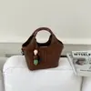 Bolso de mimbre tipo cesta ins coreano para mujer 2026 nuevo versátil diario de alta gama casual bolso de mano bolso de hombro cruzado