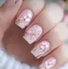 Modelo de Venda Quente para Comércio Exterior: Conjunto de Arte para Unhas com 24 Peças com Galhos de Flor de Cerejeira Clássicos de Primavera, Estilo Suave, Rosa Claro, Unhas Postiças Retangulares de Comprimento Médio Atacado