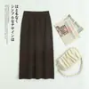 Nueva falda de lana pura engrosada para mujer, otoño e invierno, longitud media, cintura alta, estilo coreano, de punto, cachemir, interior, falda de paraguas para mujer