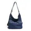 Bolsa mochila tote multiuso, bolsa de ombro transversal casual de nicho de grande capacidade para mulheres, bolsa feminina de brim lavado bordada