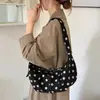Bolsa de poá de nicho nova transfronteiriça 2026 para mulheres, bolsa de ombro transversal grande capacidade fashion para o dia a dia, bolsa casual de bolinho